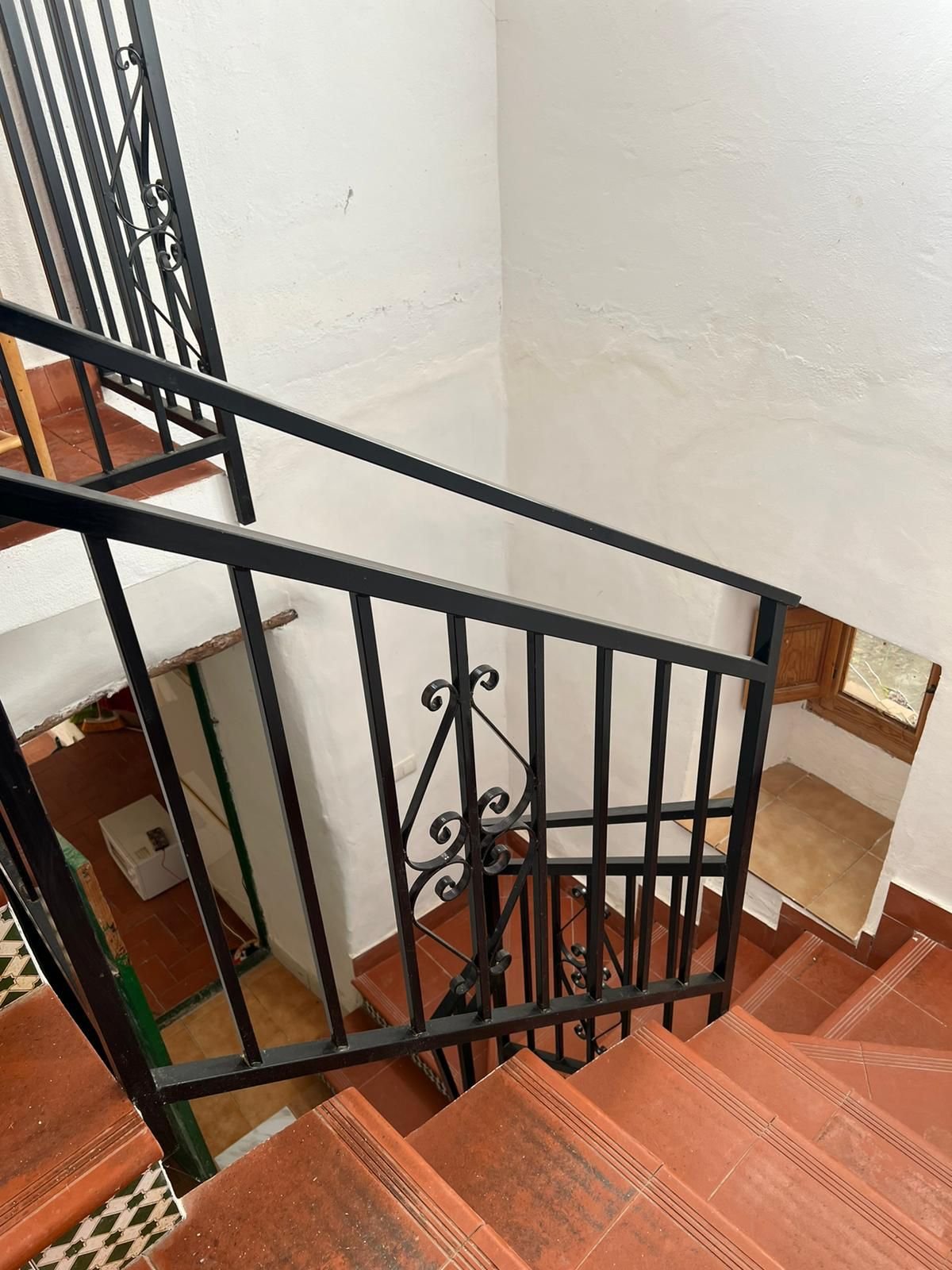Staircase leading from downstairs office/ single bedroom to upper bed rooms and roof-terrace
